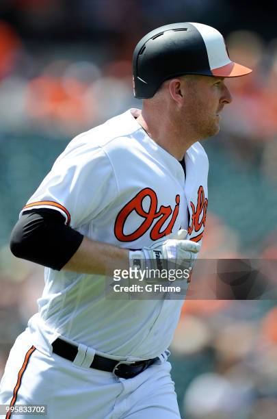 Mark Trumbo of the Baltimore Orioles rounds the bases after hitting a home run against the Los Angeles Angels at Oriole Park at Camden Yards on July...