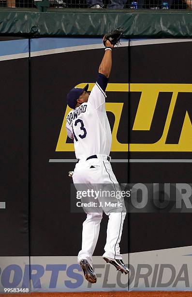 Outfielder Carl Crawford of the Tampa Bay Rays catches a fly ball against the Seattle Mariners during the game at Tropicana Field on May 15, 2010 in...