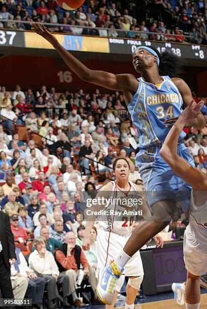 Sylvia Fowles of the Chicago Sky reaches for a rebound against the Connecticut Sun on May 15, 2010 at Mohegan Sun Arena in Uncasville, Connecticut....