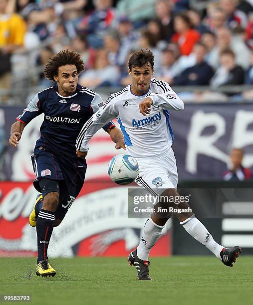 Chris Wondolowski of the San Jose Earthquakes battles against Kevin Alston of the New England Revolution at Gillette Stadium on May 15, 2010 in...