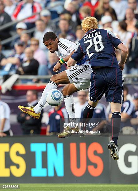 Ryan Johnson of the San Jose Earthquakes shoots on net against Pat Phalan of the New England Revolution at Gillette Stadium on May 15, 2010 in...