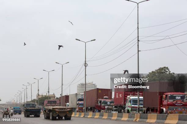 Trusks sit in traffic on Karachi Port Road in Karachi, Pakistan, on Monday, July 9, 2018. The Pakistan economy is in distress. How else to describe...