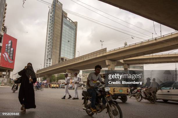 Traffic travels through an intersection in Karachi, Pakistan, on Monday, July 9, 2018. The Pakistan economy is in distress. How else to describe an...