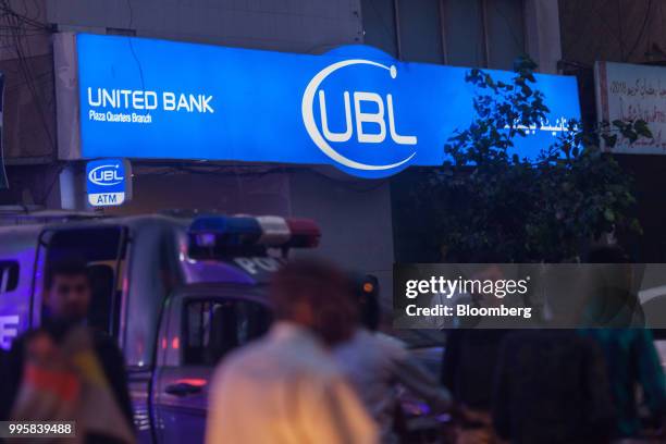 Police vehicle sits parked outside a United Bank Ltd. Branch at night in Karachi, Pakistan, on Monday, July 9, 2018. The Pakistan economy is in...