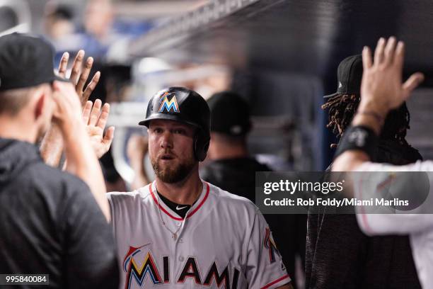 Bryan Holaday of the Miami Marlins in the dugout after scoring a run during the game against the Milwaukee Brewers at Marlins Park on July 10, 2018...