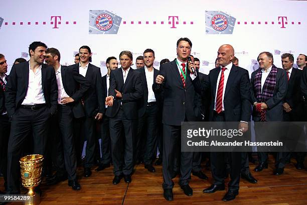 Head coach Louis van Gaal and presenter Stephan Lehmann talk to the fans during the Bayern Muenchen Champions Party after the DFB Cup Final match...
