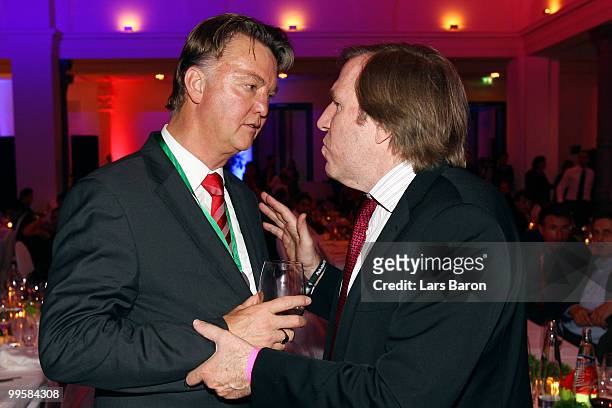 Head coach Louis van Gaal talks to Guenther Netzer talk to each other during the Bayern Muenchen Champions Party after the DFB Cup Final match...