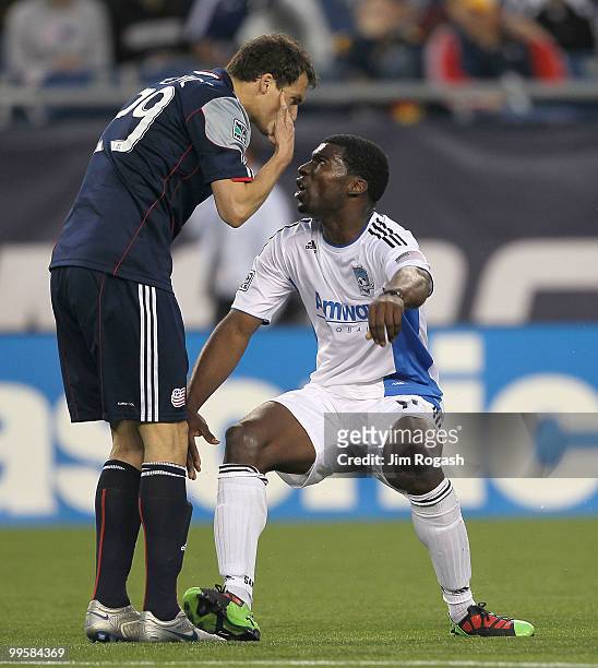 Brandon McDonald of the San Jose Earthquakes has words with Marko Perovic of the New England Revolution at Gillette Stadium on May 15, 2010 in...