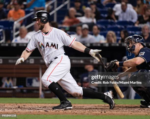 Bryan Holaday of the Miami Marlins at bat during the game against the Milwaukee Brewers at Marlins Park on July 10, 2018 in Miami, Florida.