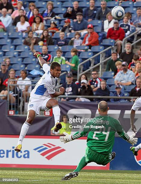 Ryan Johnson of the San Jose Earthquakes shoots on net against Preston Burpo of the New England Revolution at Gillette Stadium on May 15, 2010 in...