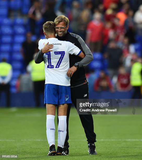 Jurgen Klopp manager of Liverpool with Carl Spellman of Tranmere Rovers at the end of the pre-season friendly match between Tranmere Rovers and...