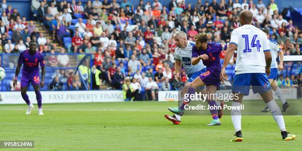 Adam Lallana of Liverpool scoring a goal during the pre-season friendly match between Tranmere Rovers and Liverpool at Prenton Park on July 10, 2018...