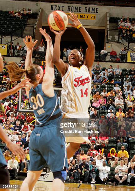 Shay Murphy of the Indiana Fever shoots over Katie Smith of the Washington Mystics at Conseco Fieldhouse on May 15, 2010 in Indianapolis, Indiana....