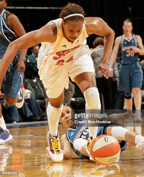 Tamika Catchings of the Indiana Fever stills the ball from Lindsey Harding of the Washington Mystics at Conseco Fieldhouse on May 15, 2010 in...