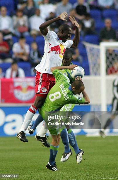 Salou Ibrahim of the New York Red Bulls collides with Peter Vagenas of the Seattle Sounders FC during their game at Red Bull Arena on May 15, 2010 in...