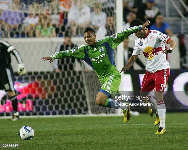 Juan Pablo Angel of the New York Red Bulls fouls Tyrone Marsdhall of the Seattle Sounders FC during their game at Red Bull Arena on May 15, 2010 in...