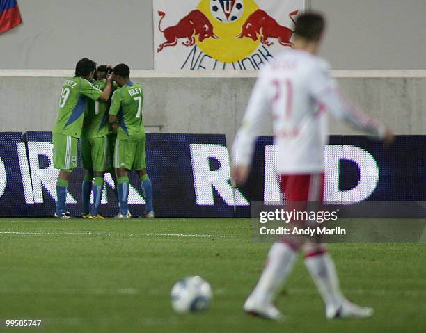 Brian Nielsen of the New York Red Bulls walks away as the Seattle Sounders FC celebrate the game winning goal by Fredy Montero#17 in the 85th minute...