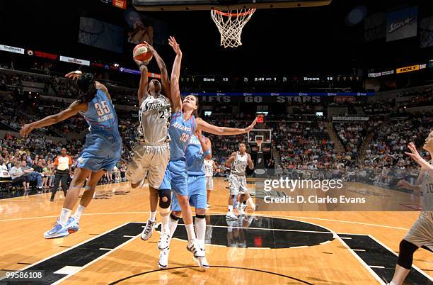 Michelle Snow of the San Antonio Silver Stars shoots against Angel McCoughtry of the Atlanta Dream during the game at AT&T Center on May 15, 2010 in...