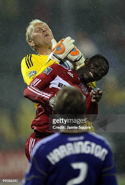 Goalkeeper Jimmy Nielsen of the Kansas City Wizards makes a save over the head of Patrick Nyarko of the Chicago Fire during the game on May 15, 2010...