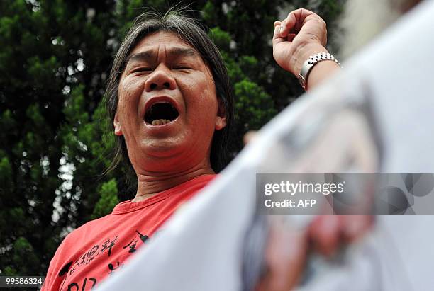 Resigned pro-democracy lawmaker "Long Hair" Leung Kwok-hung of the League of Social Democrats, the radical faction in the pro-democracy camp, shouts...