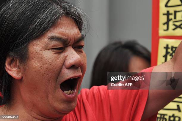 Resigned pro-democracy lawmaker "Long Hair" Leung Kwok-hung of the League of Social Democrats, the radical faction in the pro-democracy camp, shouts...