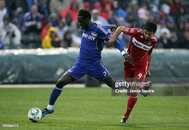 Kei Kamara of the Kansas City Wizards controls the ball as Baggio Husidic of the Chicago Fire during the game on May 15, 2010 at Community America...