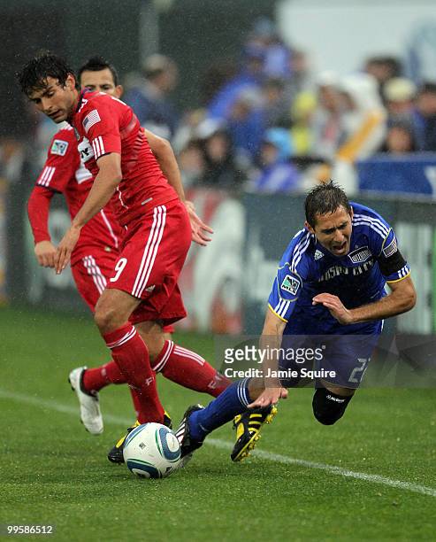 Baggio Husidic of the Chicago Fire battles Davy Arnaud of the Kansas City Wizards for the ball during the game on May 15, 2010 at Community America...