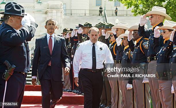 President Barack is escorted into the Twenty-Ninth Annual National Peace Officers Memorial Service by Grand Lodge Fraternal Order of Police President...