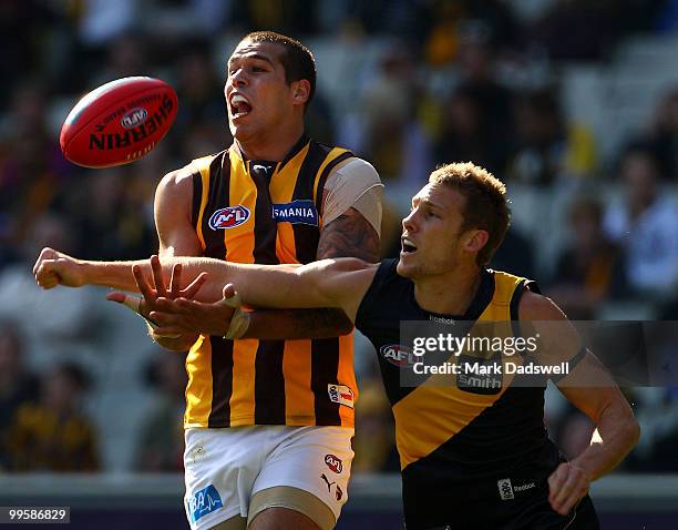 Lance Franklin of the Hawks competes with Luke McGuane of the Tigers during the round eight AFL match between the Richmond Tigers and the Hawthorn...