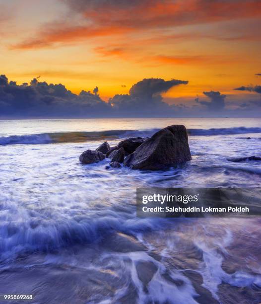 sunrise over south china sea with beautiful waves movement. taken with slow shutter, soft focus and - slow shutter stock pictures, royalty-free photos & images