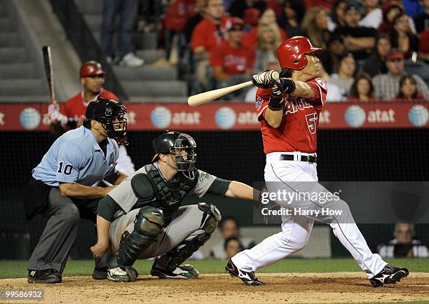 Hideki Matsui of the Los Angeles Angels hits a double against the Oakland Athletics during the sixth inning at Angels Stadium on May 15, 2010 in...