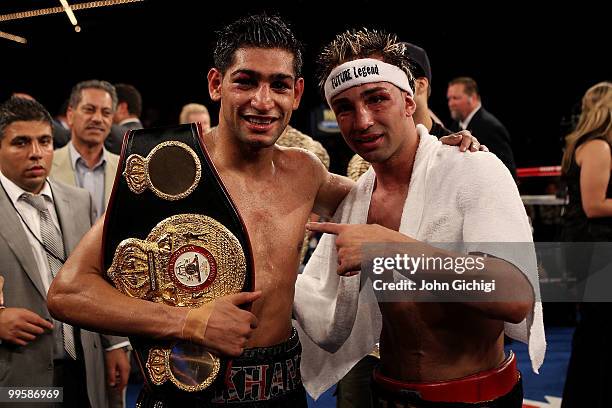 Amir Khan of Great Britain celebrates after defeating Paulie Malignaggi by TKO in the 11th round of his WBA light welterweight title fight at Madison...