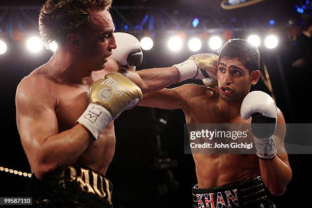 Amir Khan of Great Britain hits Paulie Malignaggi during the WBA light welterweight title fight at Madison Square Garden on May 15, 2010 in New York...