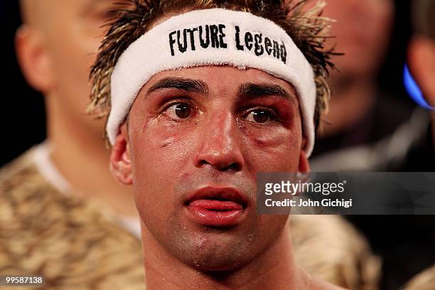 Paulie Malignaggi looks on after losing to Amir Khan of Great Britain in the 11th round by TKO during the WBA light welterweight title fight at...