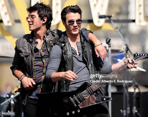 Musician Joe Jonas and musician Kevin Jonas perform live at the Grove to kick off the summer concert series on May 15, 2010 in Los Angeles,...