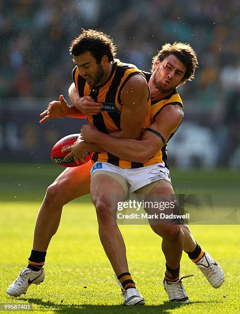 Jordan Lewis of the Hawks is tackled by Chris Newman of the Tigers during the round eight AFL match between the Richmond Tigers and the Hawthorn...