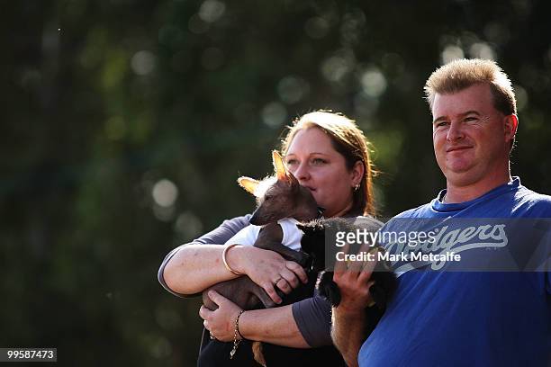 Dog owners listen for the winners of the cutest pet competition during the RSPCA Million Paws Walk at Sydney Olympic Park on May 16, 2010 in Sydney,...
