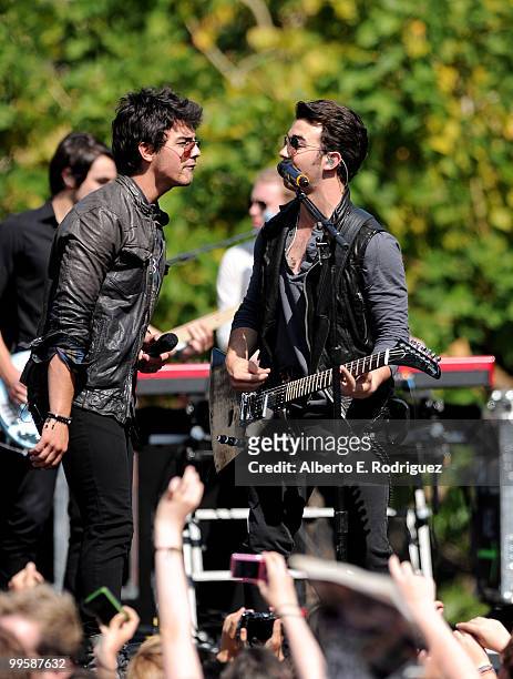Musician Joe Jonas and musician Kevin Jonas performs live at the Grove to kick off the summer concert series on May 15, 2010 in Los Angeles,...