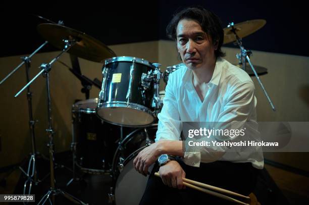 senior man playing drum set on recording studio - chofu stock-fotos und bilder
