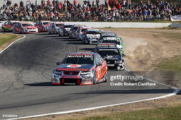 Jamie Whincup driving the Team Vodafone Holden leads during race 12 for round six of the V8 Supercar Championship Series at Winton Raceway on May 16,...