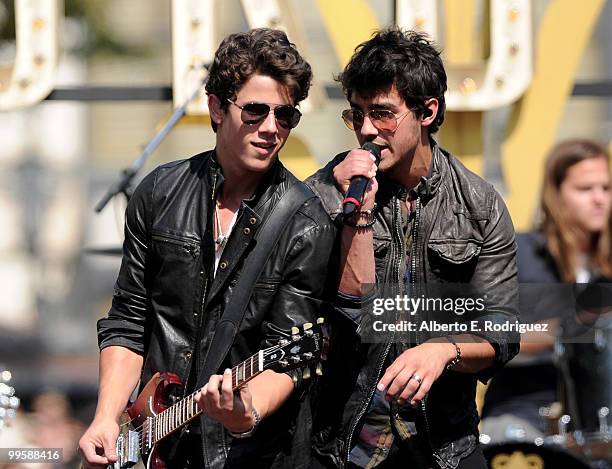 Musician Nick Jonas and musician Joe Jonas perform live at the Grove to kick off the summer concert series on May 15, 2010 in Los Angeles, California.