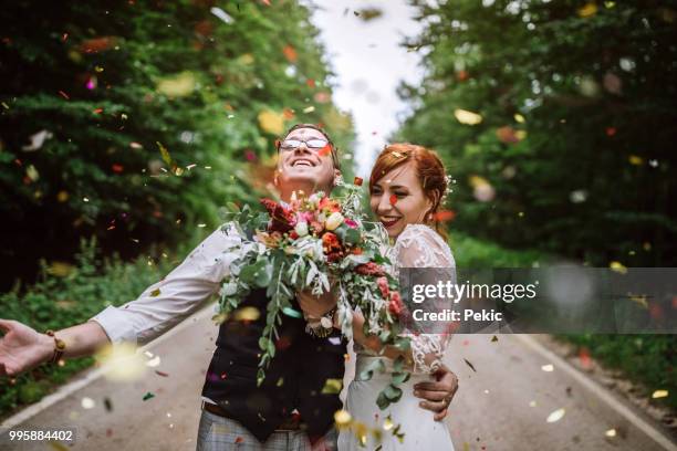 celebrating their wedding with style - couple red dress stock pictures, royalty-free photos & images