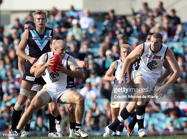 Chris Judd of the Blues is put under pressure by Port Adelaide players during the round eight AFL match between the Port Adelaide Power and the...