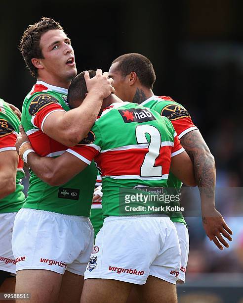 Sam Burgess and Nathan Merritt of the Rabbitohs celebrate after a try during the round ten NRL match between the Wests Tigers and the South Sydney...