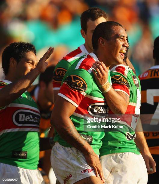 Fetuli Talanoa of the Rabbitohs celebrates with his team mates after scoring a try during the round ten NRL match between the Wests Tigers and the...