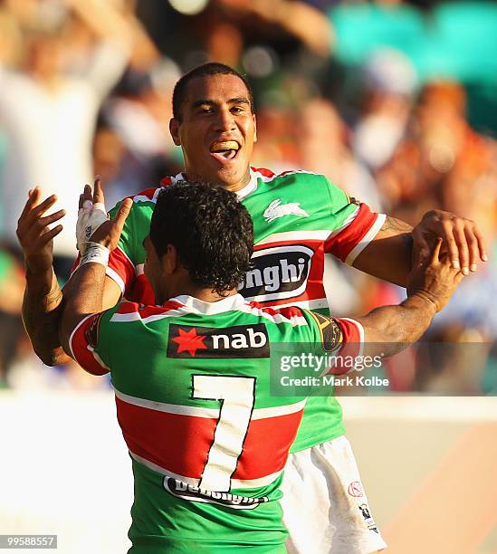 Fetuli Talanoa of the Rabbitohs celebrates with his team mates after scoring a try during the round ten NRL match between the Wests Tigers and the...