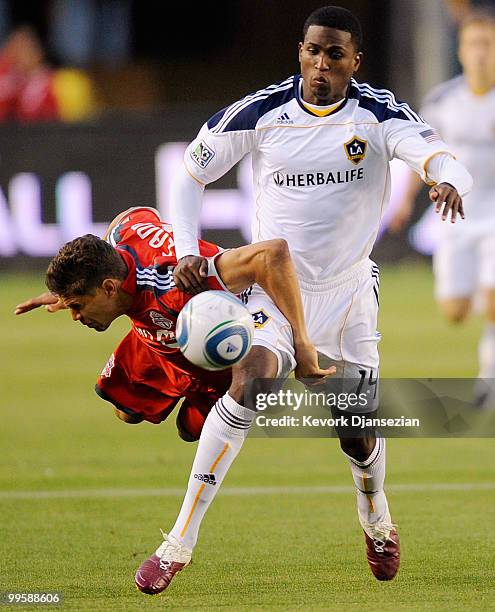 Edson Buddle of Los Angeles Galaxy controls the ball against Adrian Cann of Toronto FC during the first half of the MLS soccer match on May 15, 2010...