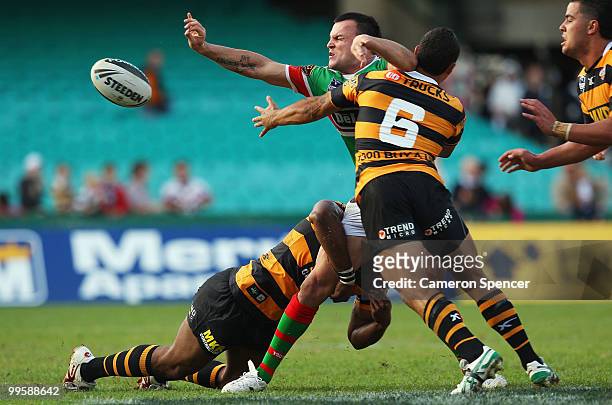 Beau Champion of the Rabbitohs offloads the ball during the round ten NRL match between the Wests Tigers and the South Sydney Rabbitohs at Sydney...