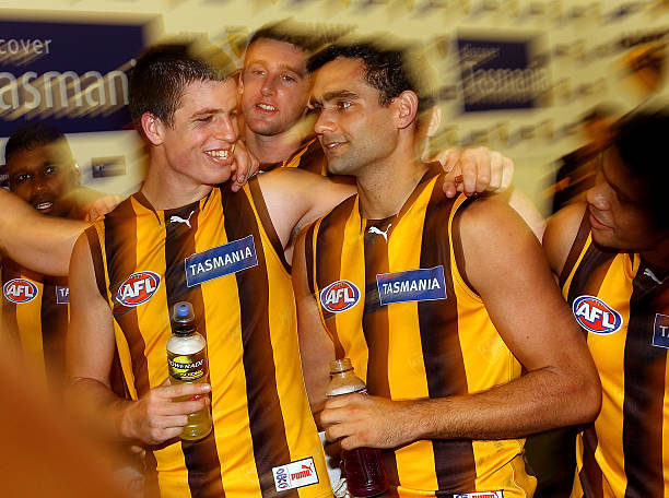 Shaun Burgoyne of the Hawks is congratulated by teammates after their win in the round eight AFL match between the Richmond Tigers and the Hawthorn...