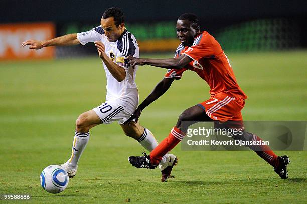 Landon Donovan of the Los Angeles Galaxy is chased by Fuad Ibrahim of Toronto FC during the second half action of the MLS soccer match on May 15,...